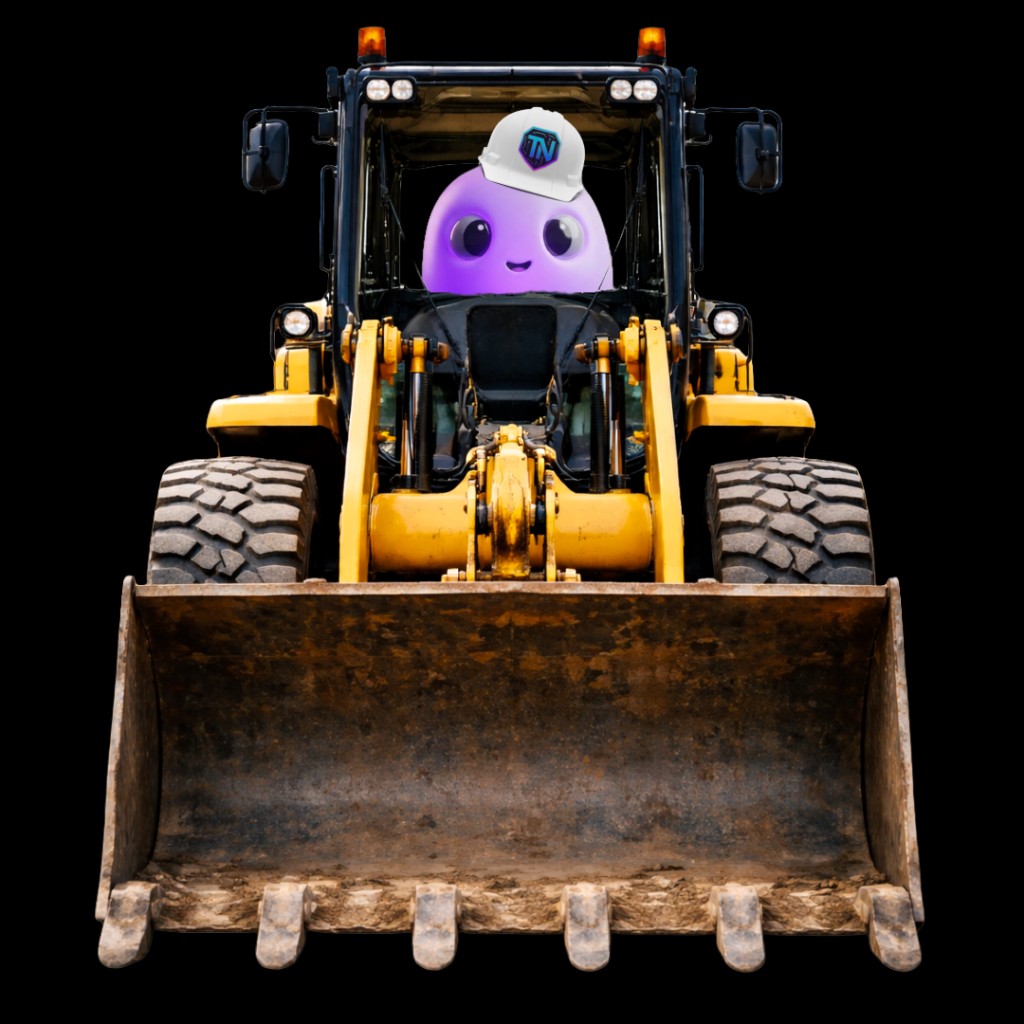 Woops at the controls of a digger, building something that fits.